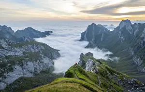 View over Saentis mountains into the valley of Meglisalp at sunrise