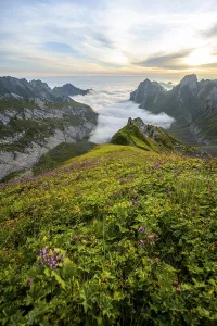 View over Saentis mountains into the valley of Meglisalp at sunrise