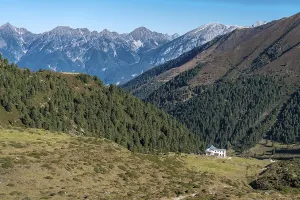 View at the Senders valley and Adolf Pichler mountain hut near Kemater Alm in Austria with high rising mountains