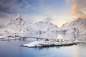 View of snow-covered islands, fjord and mountains