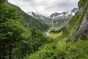 View of Stilluppbach and cloudy mountain peaks in Stillupptal