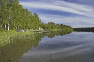 View of summer house and jetty by the lake