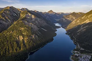 View from the summit of Schoenjoechl to Plansee and mountains at morning sun