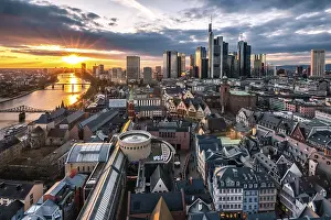View into the sunset over an old town to the skyline