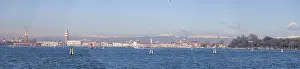 View of Venice from Lido, snow-capped alpine peaks in the back