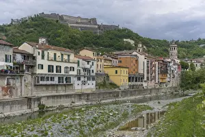 View over the village of Gavi with the old town and the fort