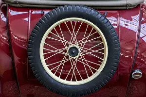 The back view of vintage car with spare wheel