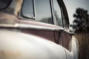Side view of a vintage Jaguar car's rear window