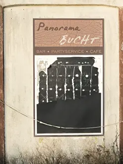 Category Historic EN Prints: View of a weathered scoreboard of an abandoned pub