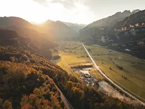 View of a wide valley at dusk with roads