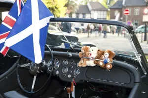 View through the windscreen of a classic car on a castle square