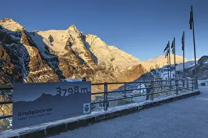 Viewing platform in front of a mountain peak in the morning light