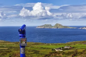 Viewpoint with blue telescope, coin-operated telescope on the coast