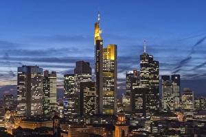 Views of the city skyline at dusk and lit skyscrapers