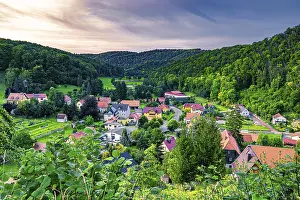 The village of Tautenburg surrounded by mixed forest in summer at sunset