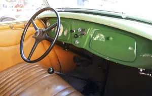 Vintage car interior with classic steering wheel