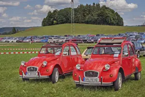 Vintage car meeting, two red Citroen 2CV