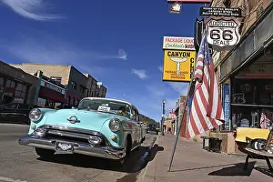 Vintage car parked in front of souvenir shop on Route 66