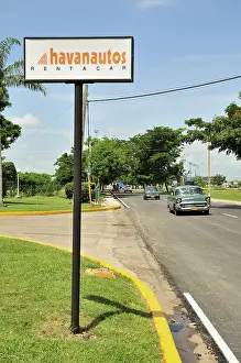 Vintage car and a sign from Havanautos