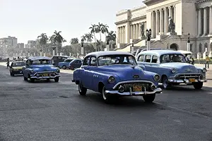Several vintage cars from the 50s in the centre of Havana