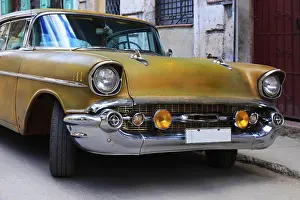Vintage cars moving on the streets of colorful Havana