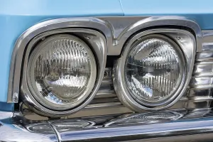 Vintage Headlights of a blue old-timer
