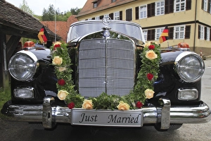 Vintage Mercedes Benz 300 car with wedding decorations