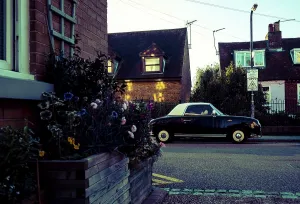 Vintage Nissan Figaro car, parked on the street