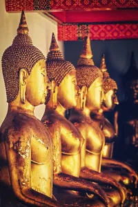 Vintage retro effect filtered hipster style image of sitting Buddha statues in Buddhist temple Wat Pho