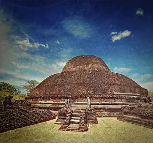 Vintage retro hipster style travel image of ancient Buddhist dagoba (stupe) Pabula Vihara with grunge texture overlaid