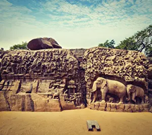 Vintage retro hipster style travel image of Descent of the Ganges and Arjuna's Penance ancient stone sculpture