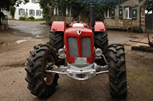 Vintage Schlueter tractor on a farm