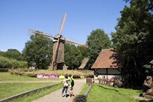 Visitors in front of the Bockwindmuehle windmill at the Muehlenhof Open-Air Museum