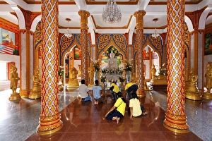 Visitors praying in front of the altar