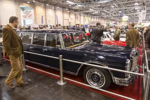 Visitors to Techno Classica take a look at a Mercedes Benz 600
