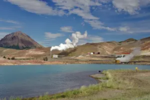 Volcanic mountains, lake with surreal colour