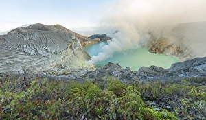 Volcano Kawah Ijen, volcanic craters with crater lake and steaming vents