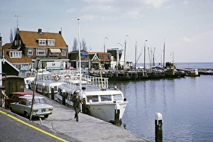 Volendam, Netherlands, 1973 Tourist boats on the quay, behind them fishing boats
