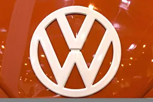 The front of a Volkswagen bus with a large VW logo