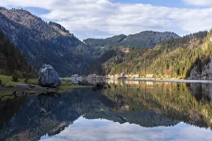 The Vordere Gosausee in autumn with a view of the Gasthof Gosausee