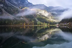 The Vordere Gosausee in autumn with a view of the Gasthof Gosausee