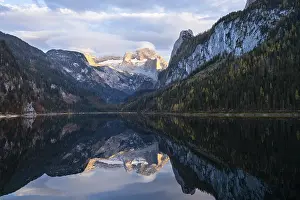 The Vordere Gosausee lake in autumn with a view of the Dachstein mountain range