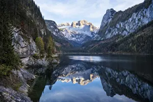 The Vordere Gosausee lake in autumn with a view of the Dachstein mountain range