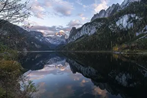 The Vordere Gosausee lake in autumn with a view of the Dachstein mountain range