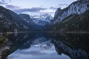 The Vordere Gosausee lake in autumn with a view of the Dachstein mountain range