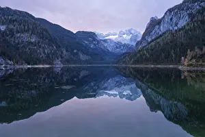 The Vordere Gosausee lake in autumn with a view of the Dachstein mountain range