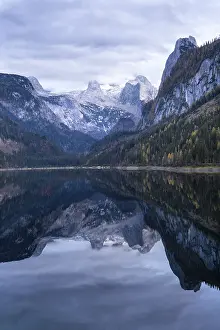 The Vordere Gosausee lake in autumn with a view of the Dachstein mountain range