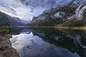 The Vordere Gosausee lake in the morning in autumn with a view of the Dachstein mountain range