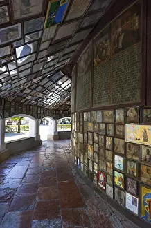 Votive plaques in the walkway around the Chapel of Grace