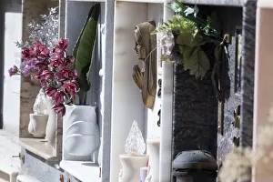 Wall with decorated urns graves in a cemetery in Sardinia